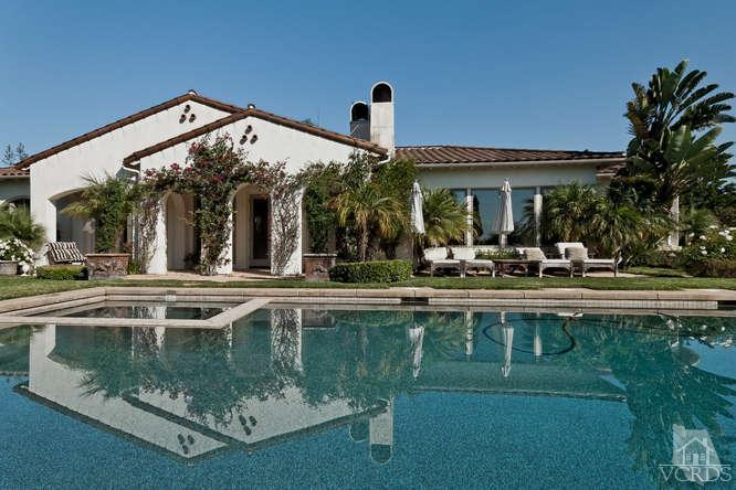 430 Sereno Place Camarillo, CA 93010 - Photo 25 of 33 a view of a house with a swimming pool and a table and chairs in patio