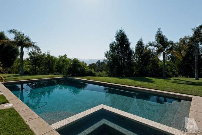 430 Sereno Place Camarillo, CA 93010 - Photo 26 of 33 a view of a swimming pool with a lake view