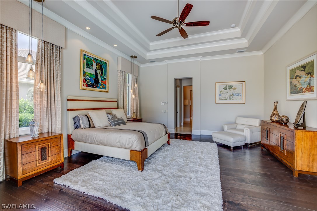 4257 Deephaven Lane Naples, FL 34119 - Photo 12 of 13 a bedroom with a bed couch and a window