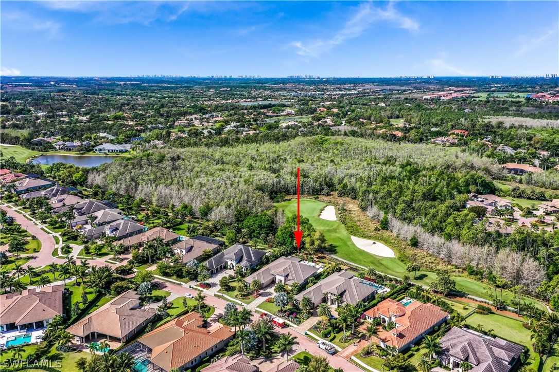 4257 Deephaven Lane Naples, FL 34119 - Photo 3 of 13 an aerial view of residential houses with outdoor space and trees