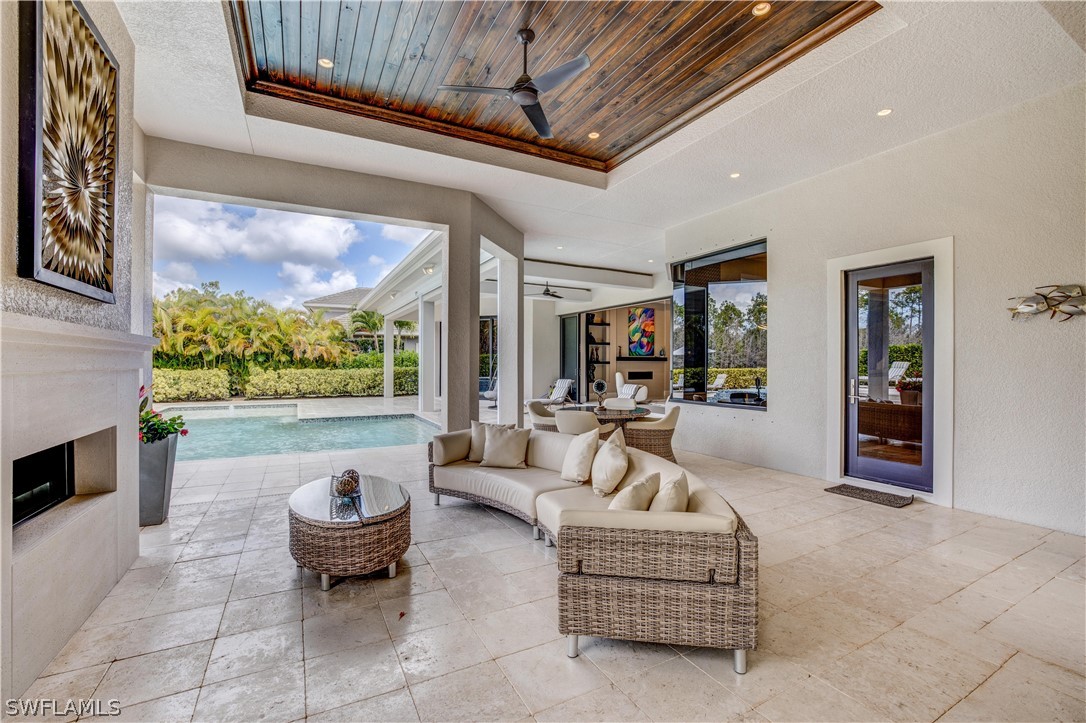 4257 Deephaven Lane Naples, FL 34119 - Photo 10 of 13 a living room with furniture and a large window