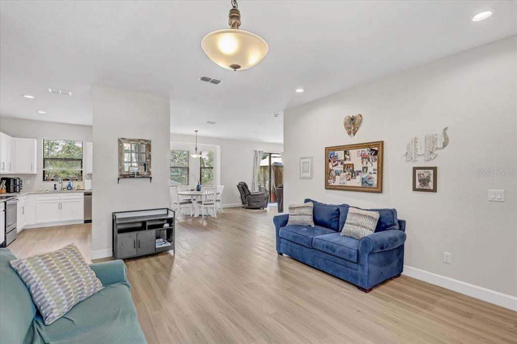 7314 Madrid Road Weeki Wachee, FL 34613 - Photo 7 of 54 a living room with furniture and wooden floor
