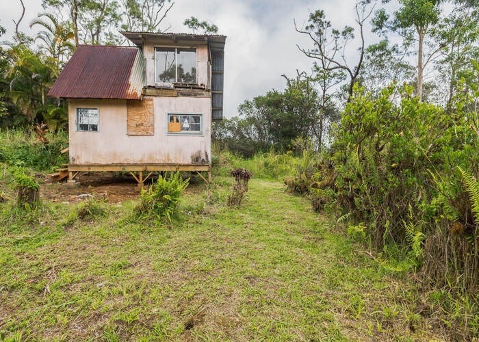 59 Kaiwiki Road Hilo, HI 96720 - Photo 5 of 22 a front view of a house with a yard