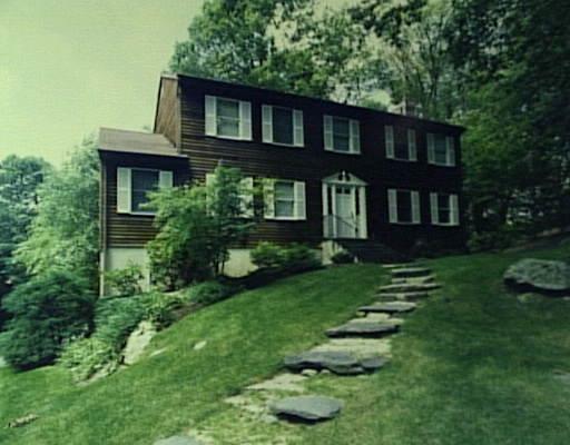 1947 Long Ridge Road Stamford, CT 06903 - Photo 1 of 1 a front view of a house with a garden