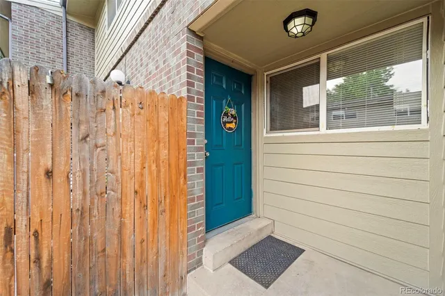 a view of a door and wooden floor