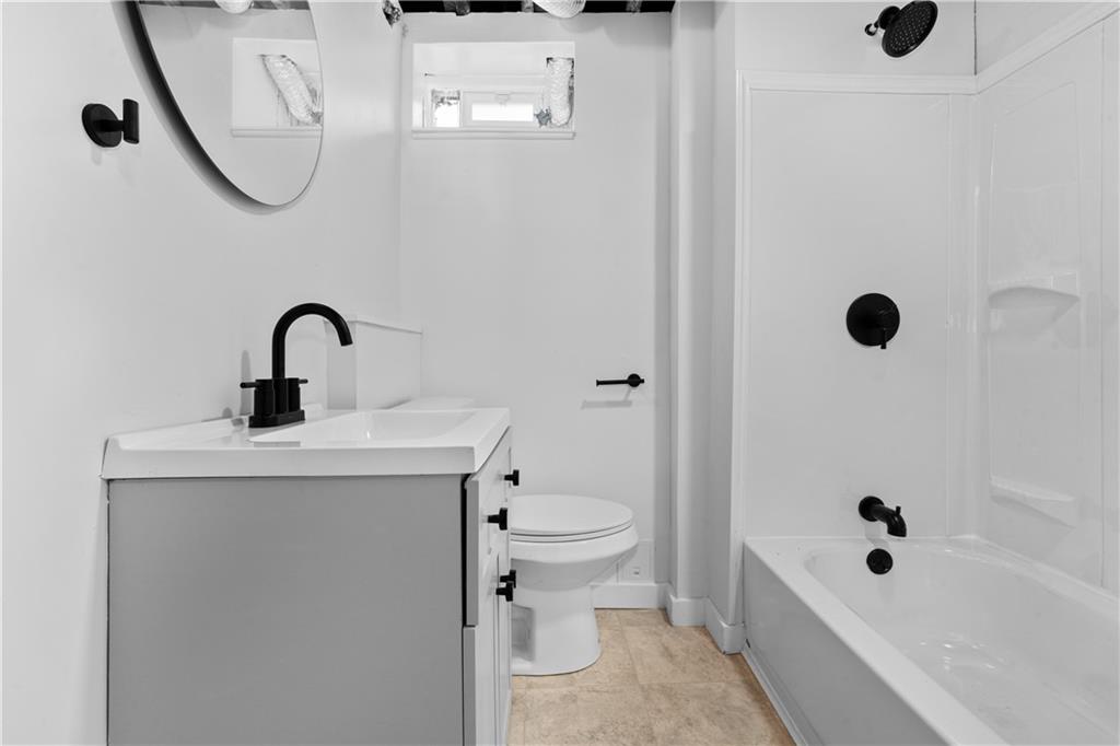 309 North Mathilda Street Pittsburgh, PA 15224 - Photo 21 of 30 a bathroom with a sink a toilet and a tub