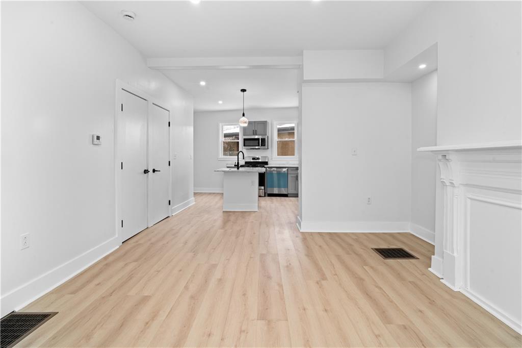 309 North Mathilda Street Pittsburgh, PA 15224 - Photo 7 of 30 a view of a kitchen with a sink and cabinets