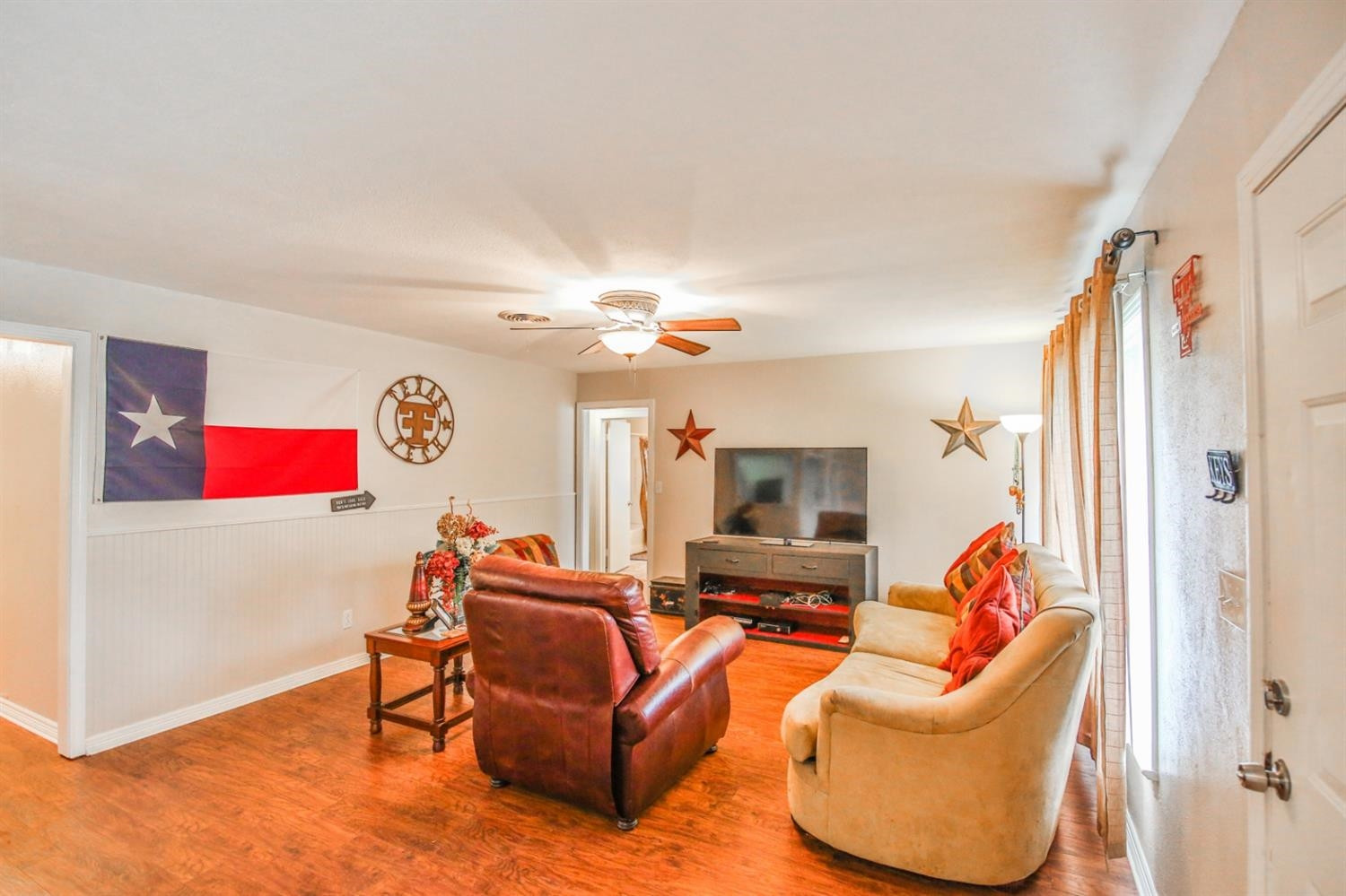 3408 38th Street Lubbock, TX 79413 - Photo 6 of 10 a living room with furniture and a couch
