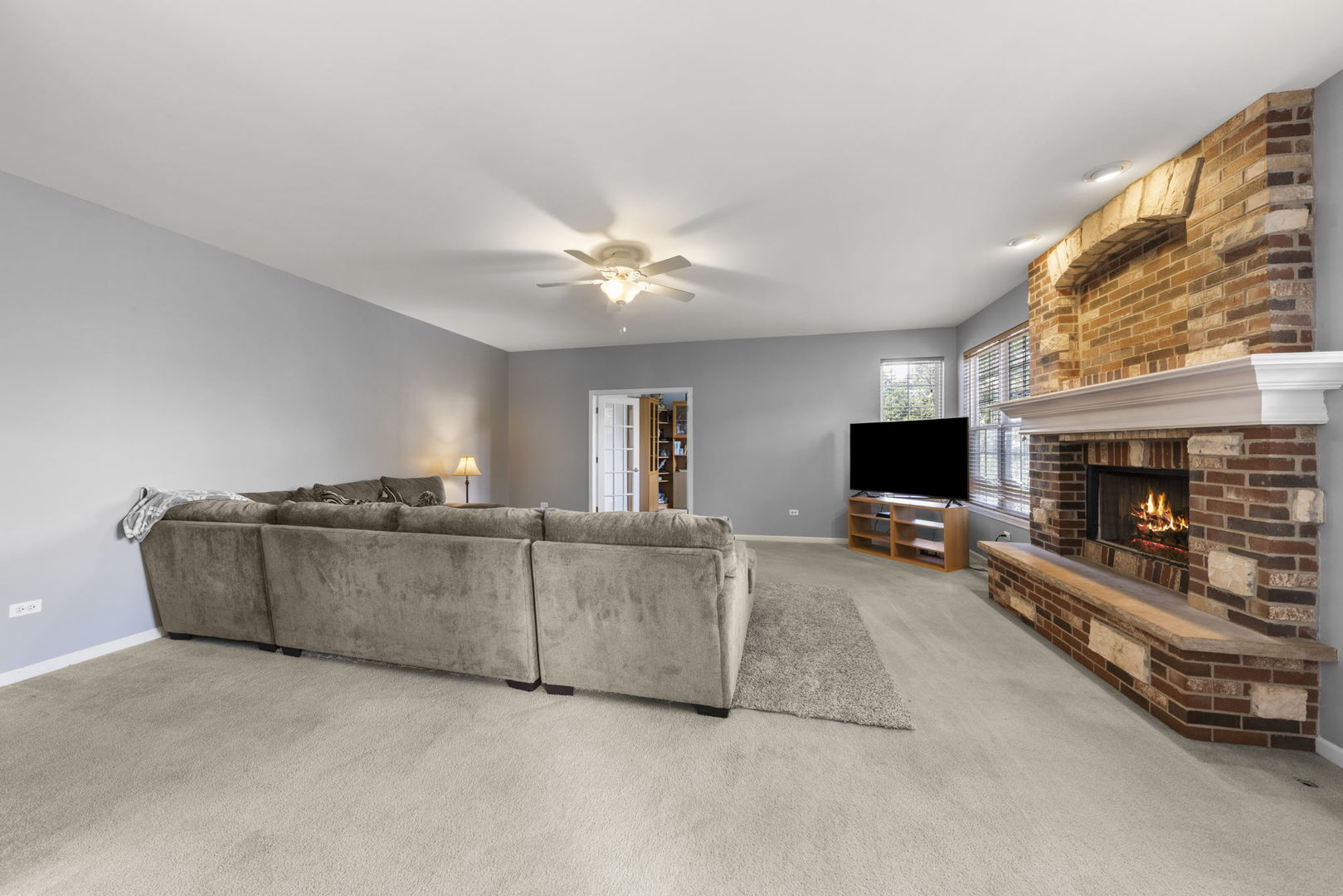 26210 Mapleview Drive Plainfield, IL 60585 - Photo 14 of 55 a living room with furniture and a flat screen tv