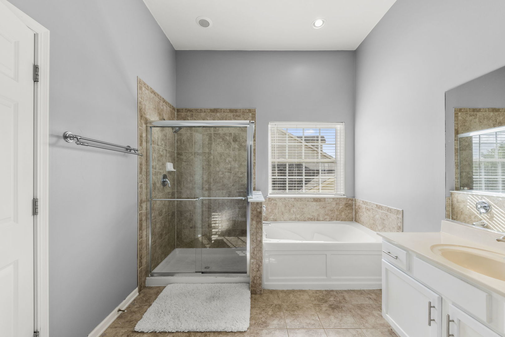 26210 Mapleview Drive Plainfield, IL 60585 - Photo 22 of 55 a bathroom with a tub shower and sink