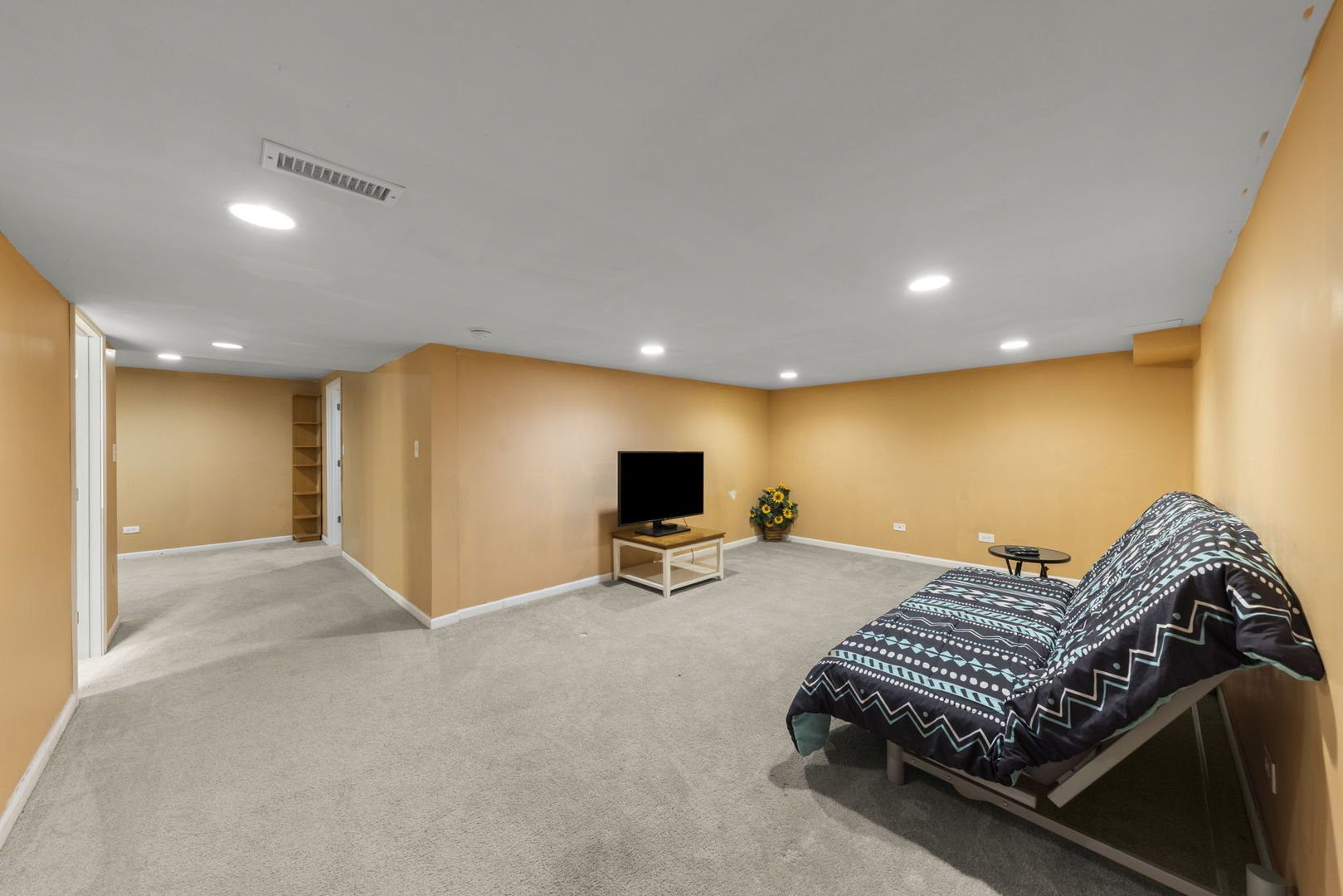 26210 Mapleview Drive Plainfield, IL 60585 - Photo 32 of 55 a living room with furniture a flat screen tv and a ceiling fan