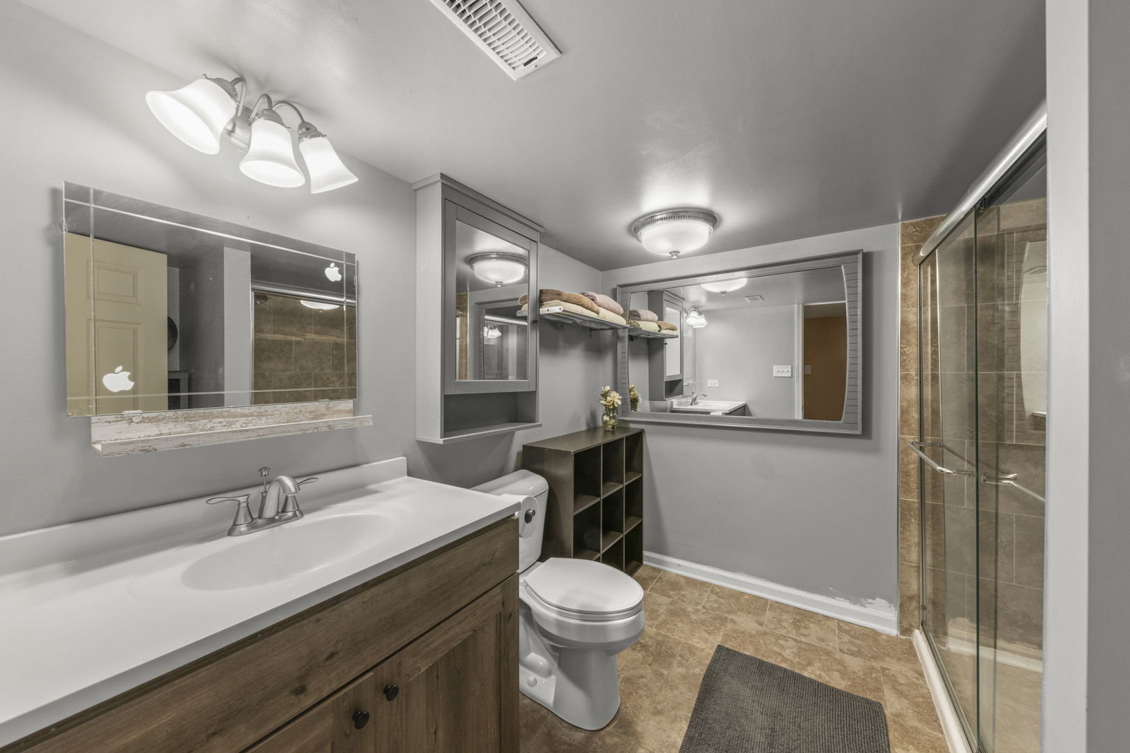 26210 Mapleview Drive Plainfield, IL 60585 - Photo 34 of 55 a bathroom with a granite countertop sink toilet a large mirror and shower