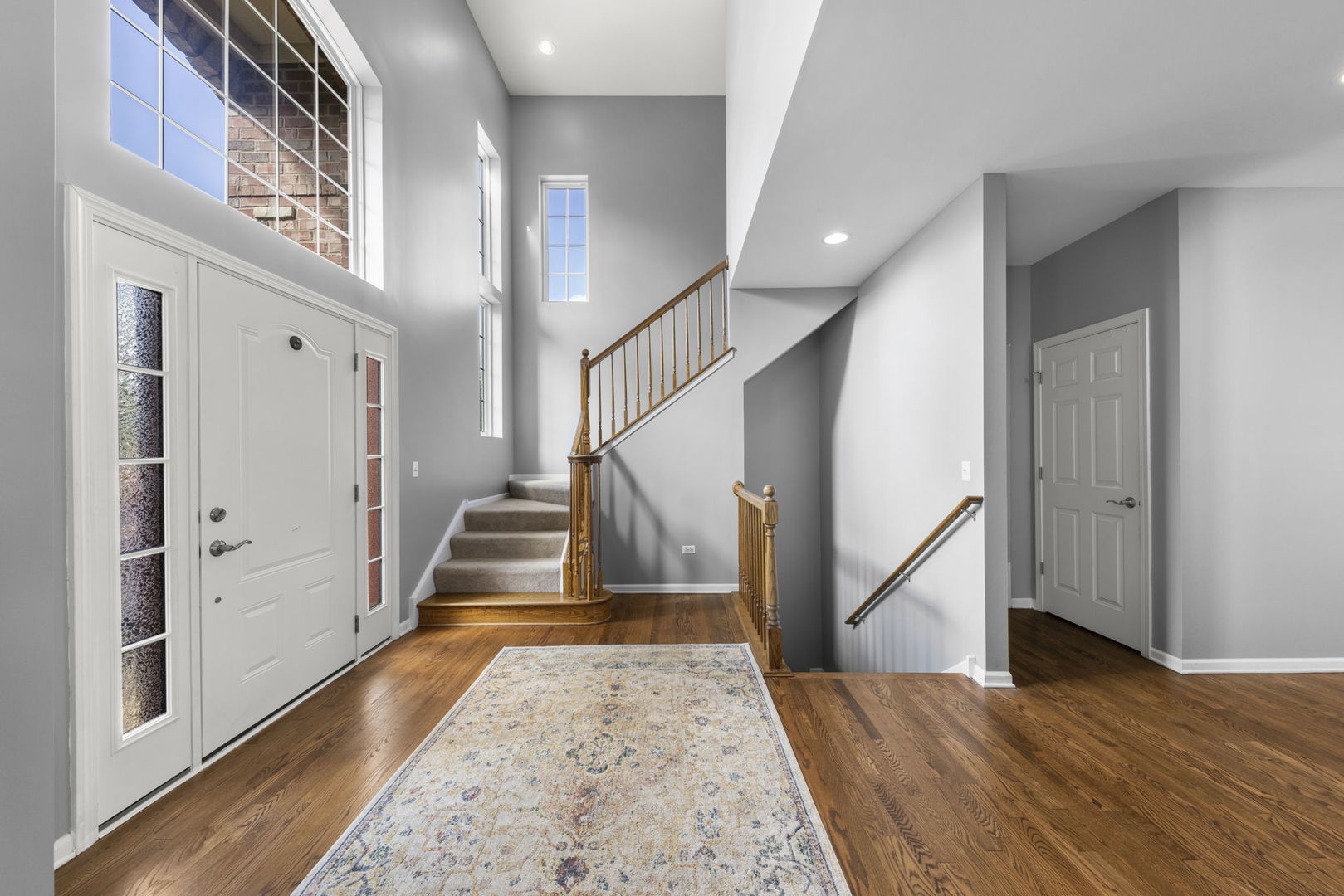 26210 Mapleview Drive Plainfield, IL 60585 - Photo 5 of 55 a view of entryway and hall with wooden floor