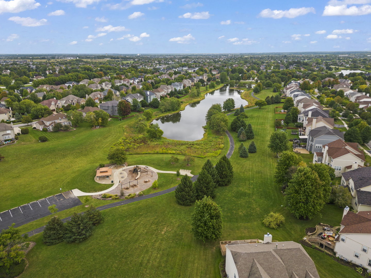 26210 Mapleview Drive Plainfield, IL 60585 - Photo 51 of 55 a view of a lake with a yard
