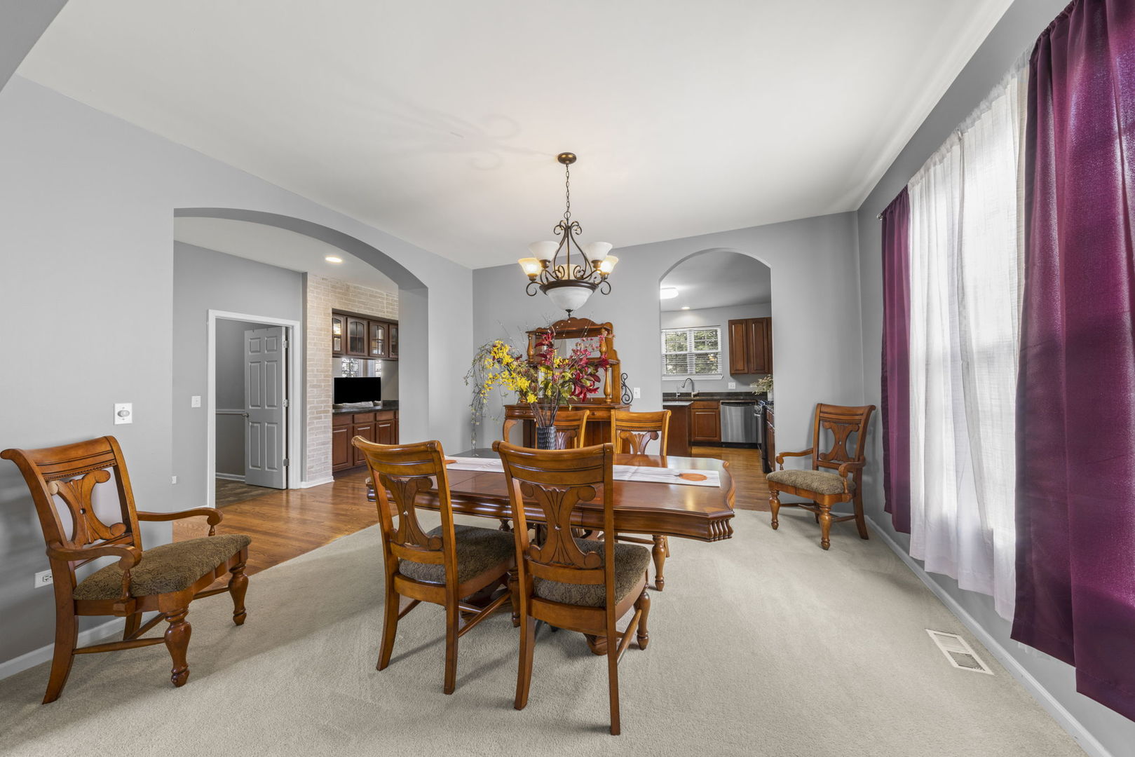 26210 Mapleview Drive Plainfield, IL 60585 - Photo 7 of 55 a view of a dining room with furniture and chandelier