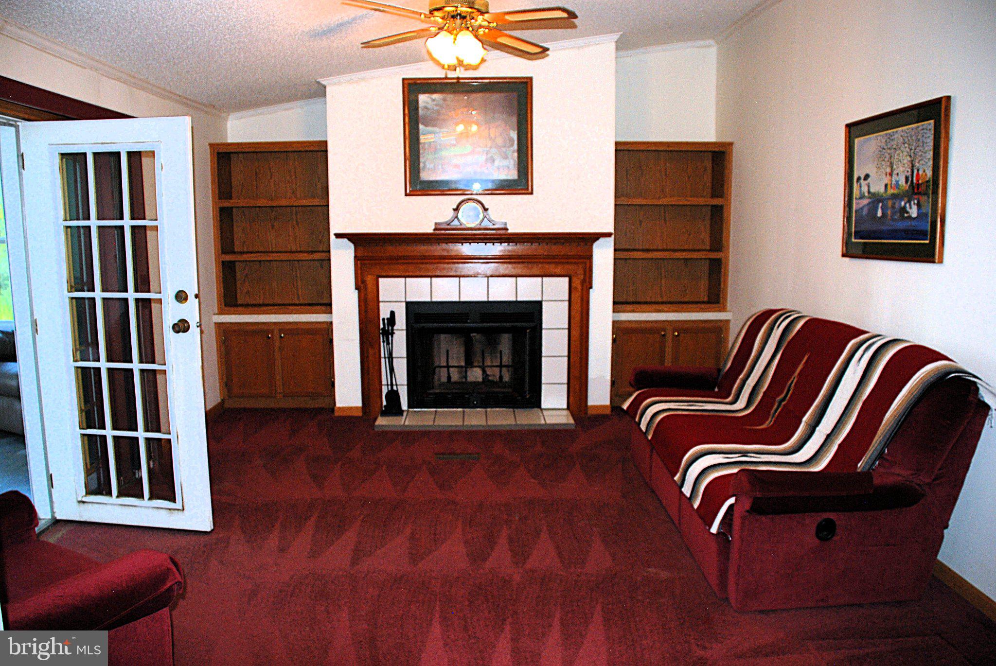 4508 Lewiston Road Bumpass, VA 23024 - Photo 59 of 84 Cozy living space with fireplace charm.