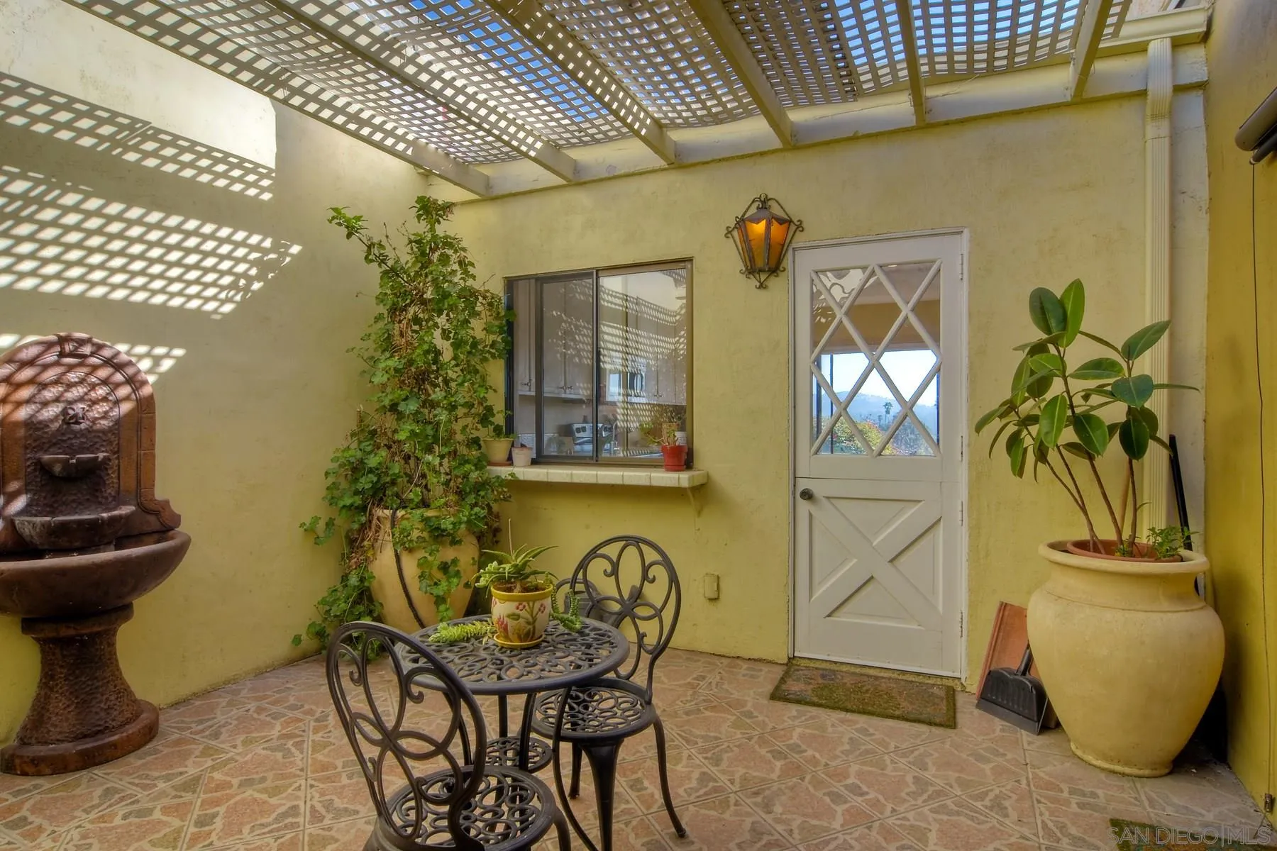 13416 The Square Poway, CA 92064 - Photo 16 of 35 a view of a door and chair in the patio