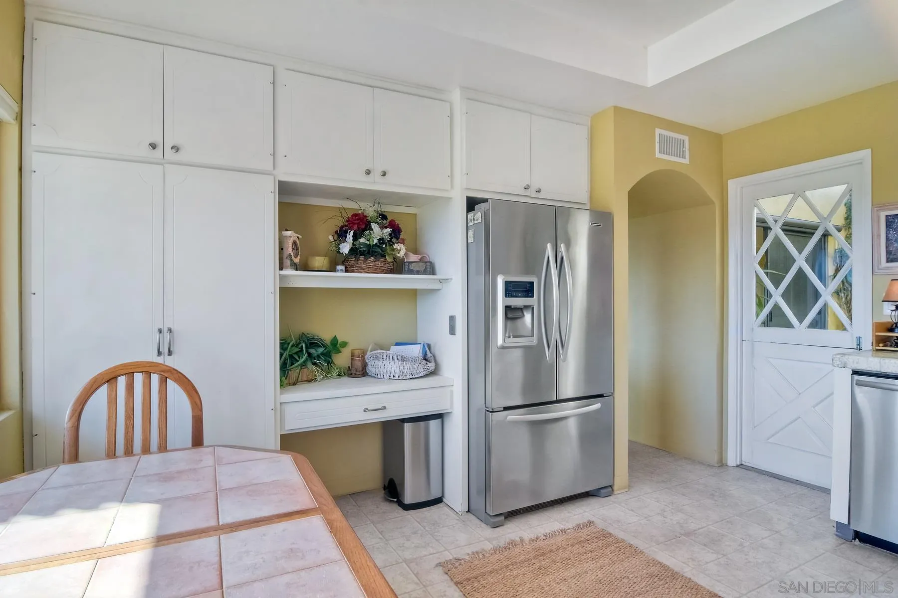 13416 The Square Poway, CA 92064 - Photo 20 of 35 a kitchen with stainless steel appliances granite countertop a refrigerator and a stove
