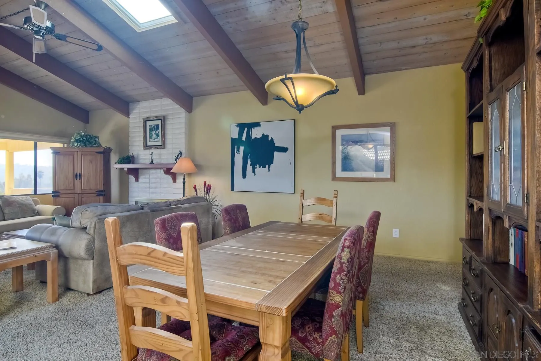 13416 The Square Poway, CA 92064 - Photo 22 of 35 a view of a dining room with furniture and a chandelier