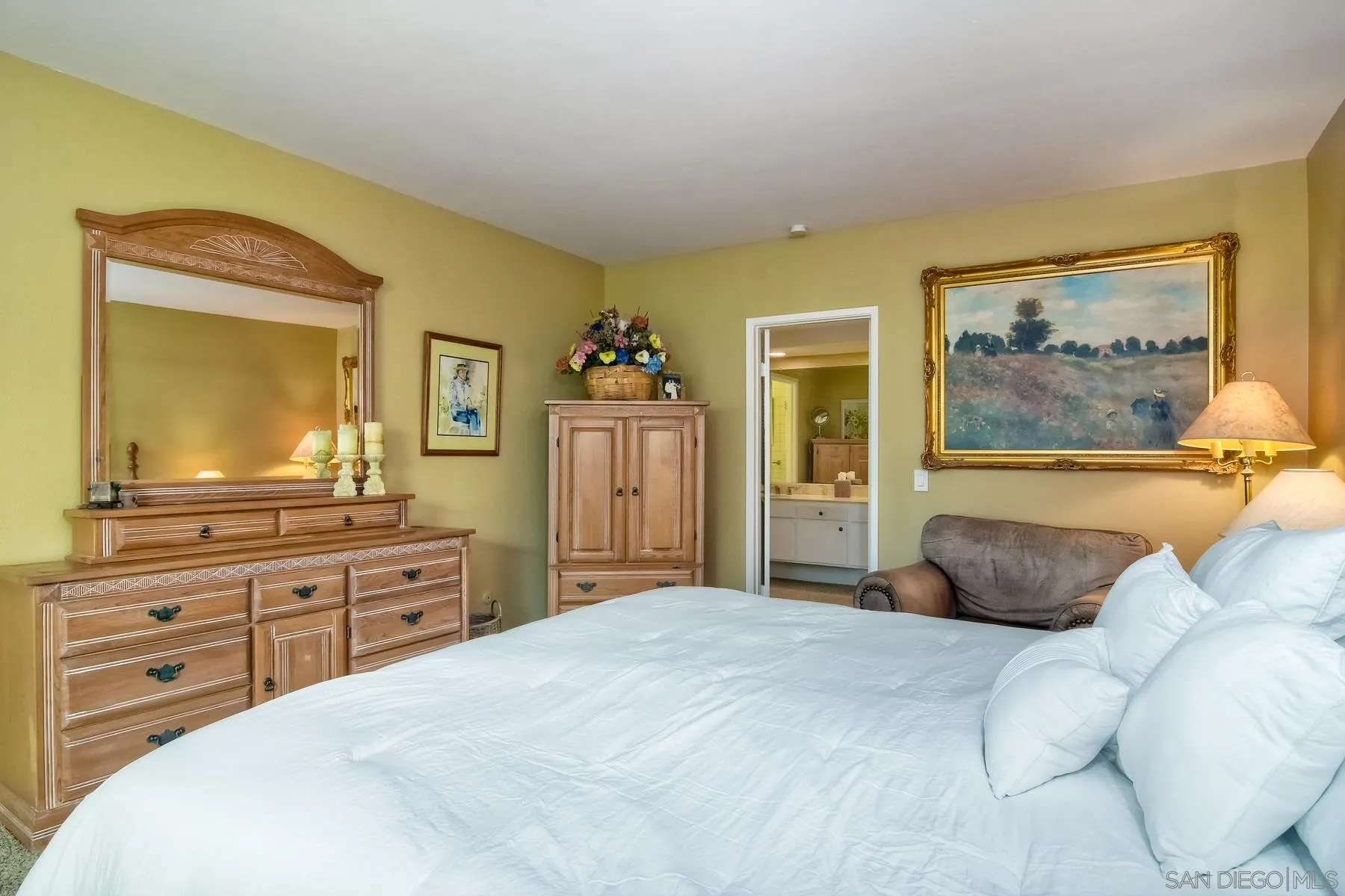 13416 The Square Poway, CA 92064 - Photo 24 of 35 a bedroom with a large bed and a dresser