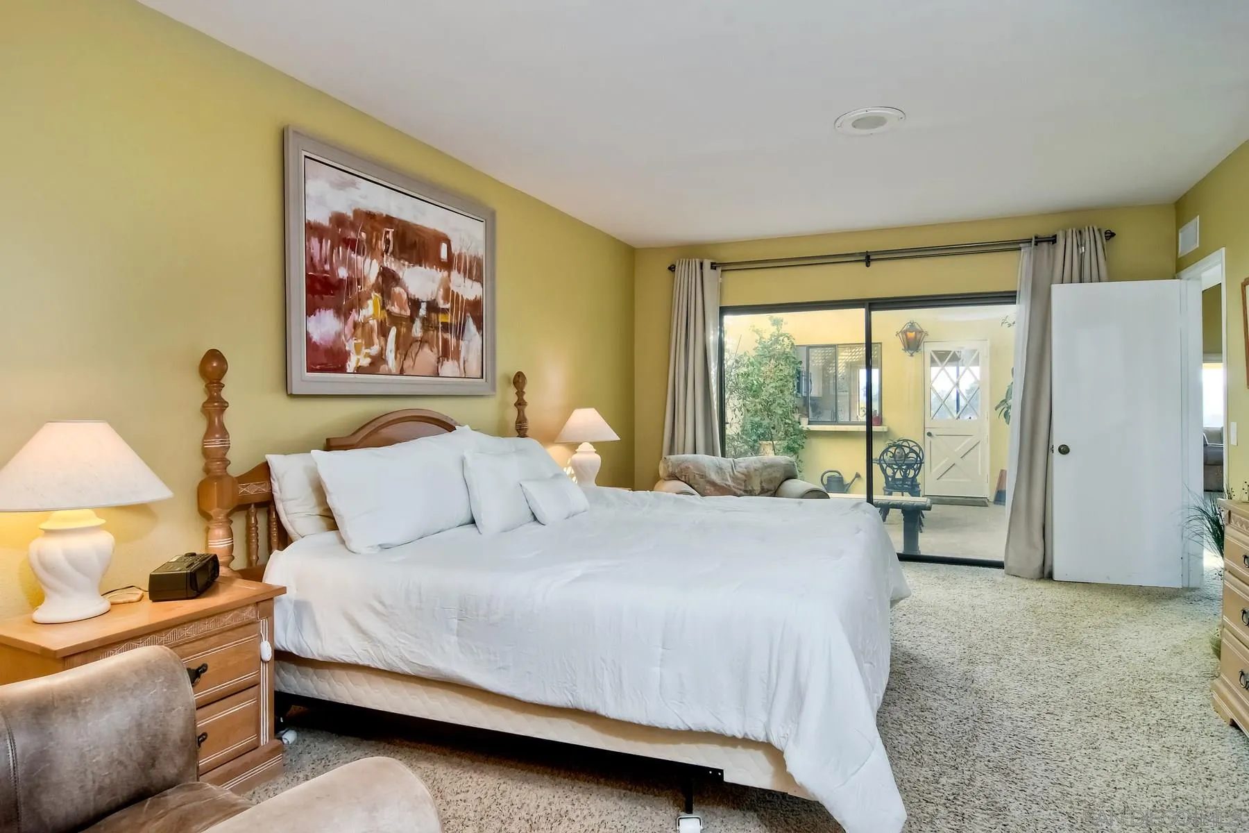 13416 The Square Poway, CA 92064 - Photo 27 of 35 a spacious bedroom with a bed and a large window