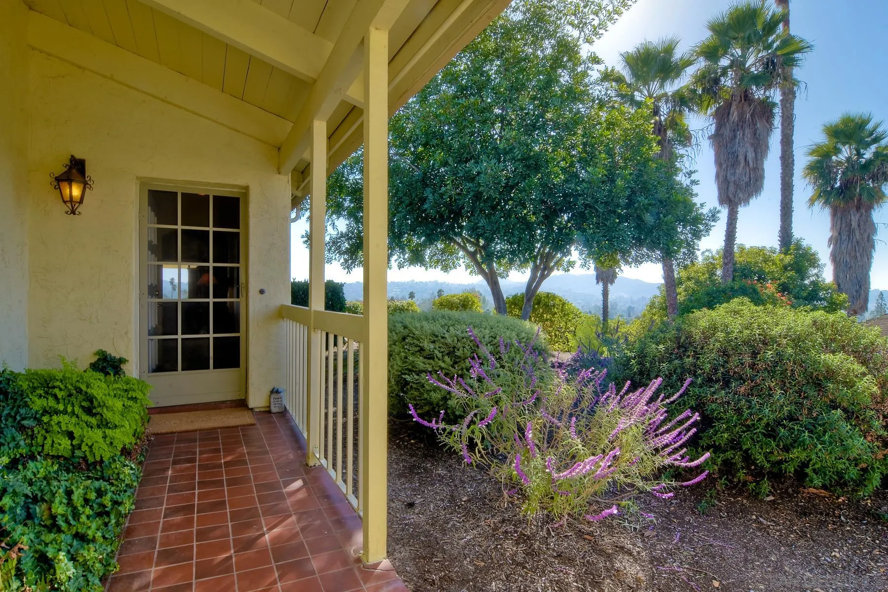 13416 The Square Poway, CA 92064 - Photo 3 of 35 a front view of a house with a garden