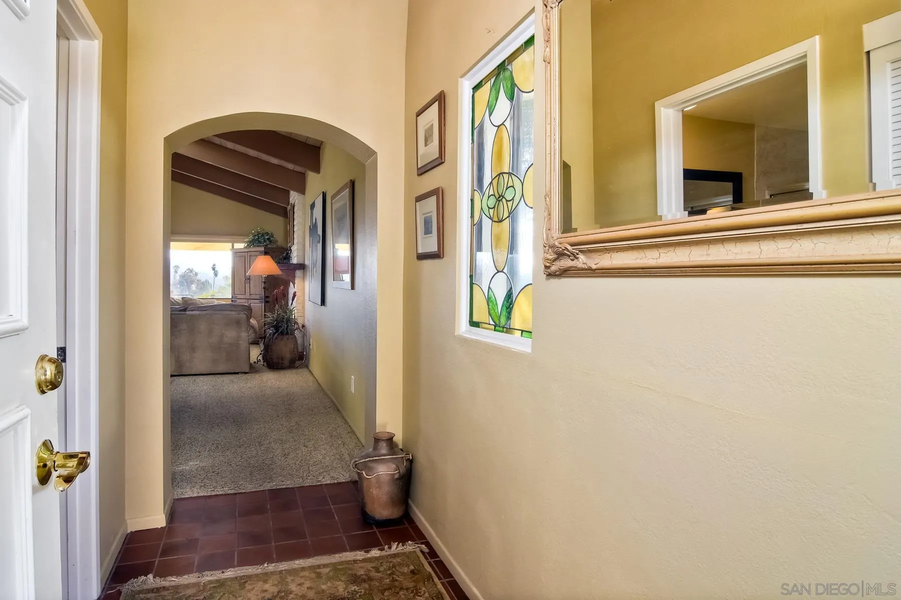 13416 The Square Poway, CA 92064 - Photo 4 of 35 a view of hallway with livingroom and wooden floor