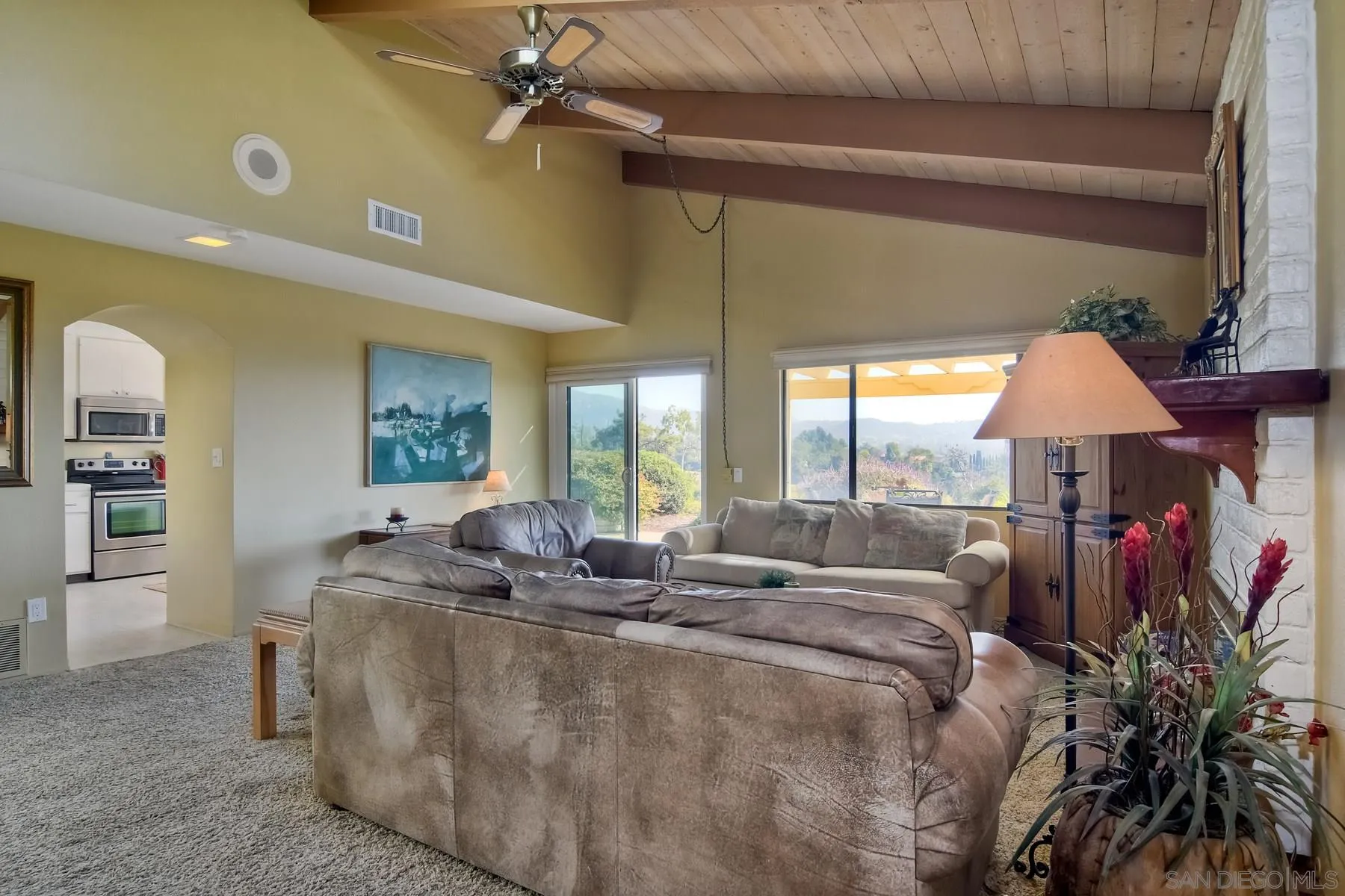 13416 The Square Poway, CA 92064 - Photo 5 of 35 a living room with furniture and a flat screen tv