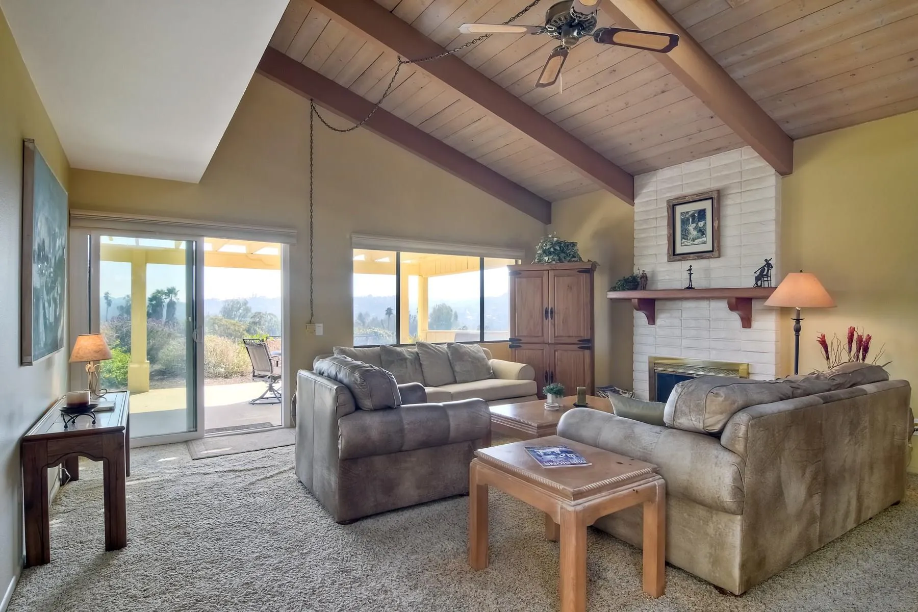 13416 The Square Poway, CA 92064 - Photo 6 of 35 a living room with furniture a fireplace and a table