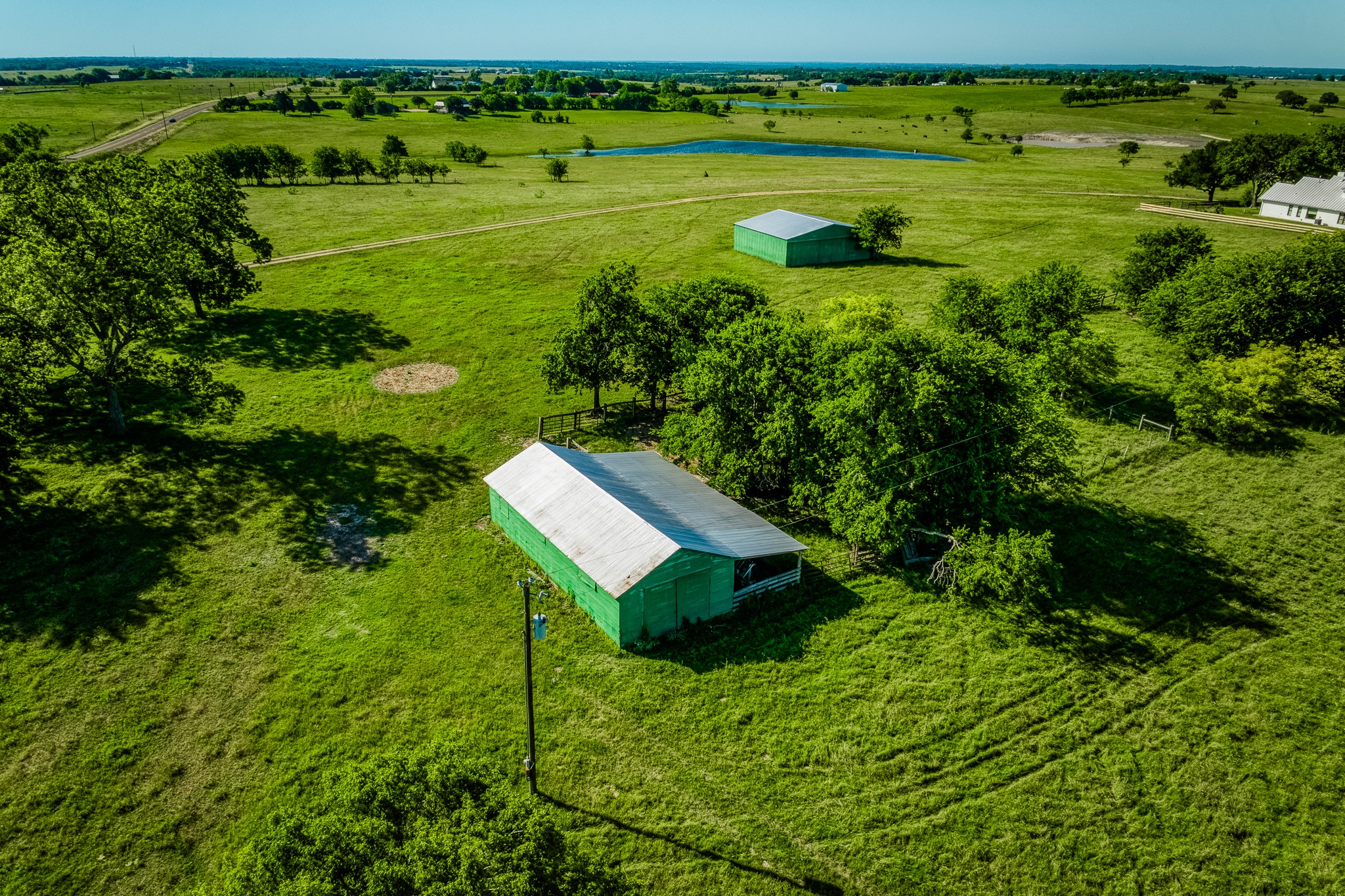 5005 Fuchs Road Burton, TX 77835 - Photo 12 of 12 a view of a golf course with a lake