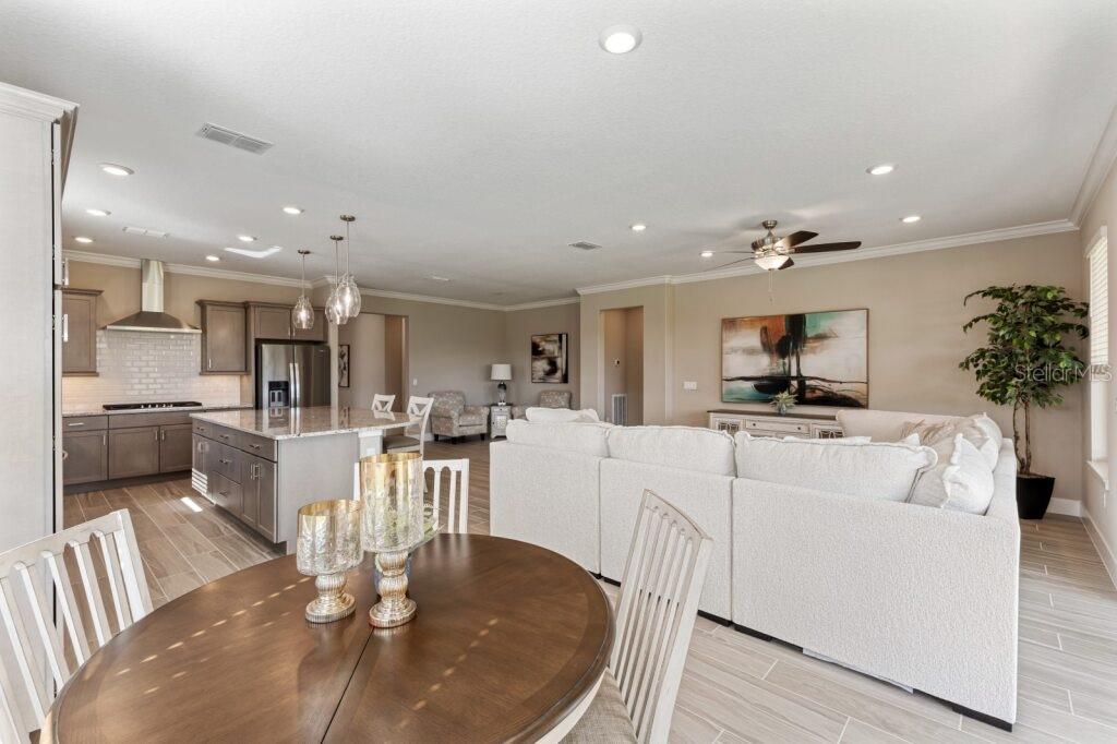 4529 Northwest 53rd Avenue Road Ocala, FL 34482 - Photo 11 of 17 a living room with furniture and kitchen view