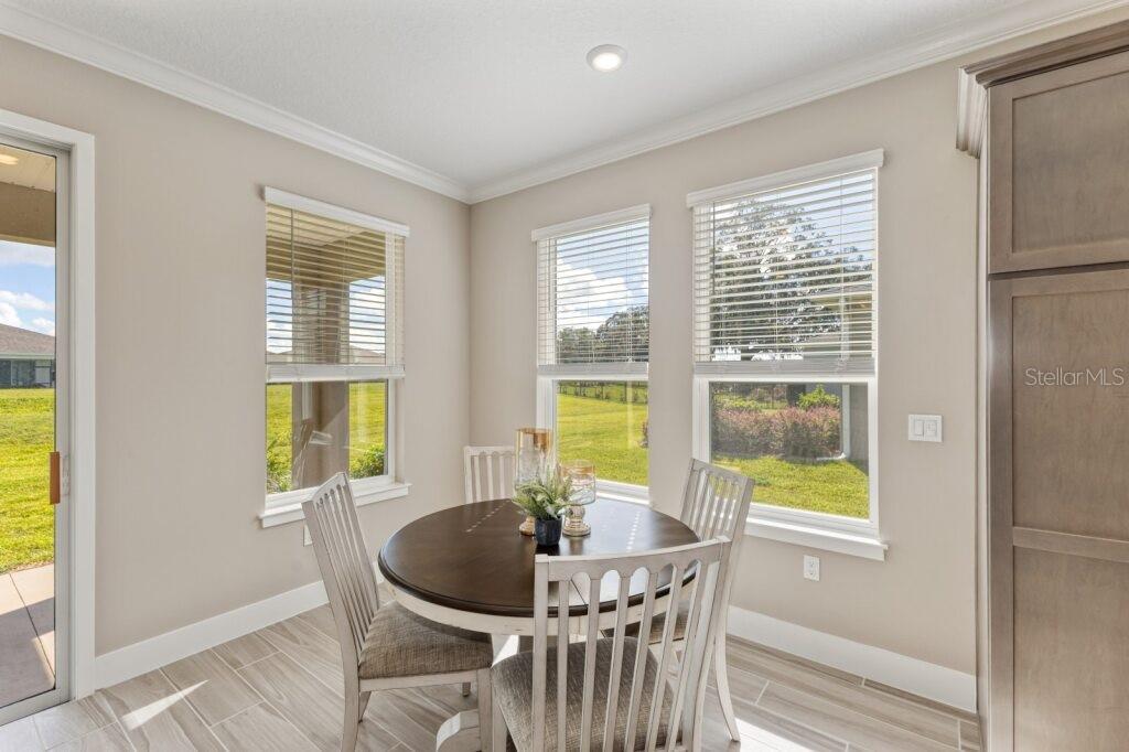 4529 Northwest 53rd Avenue Road Ocala, FL 34482 - Photo 12 of 17 a dining room with furniture and window