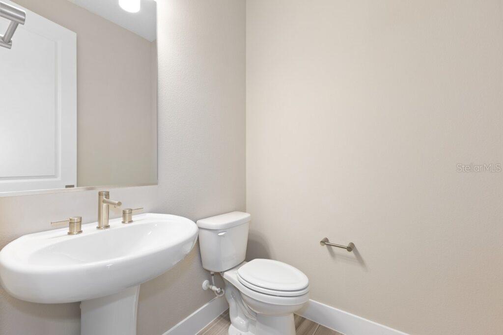 4529 Northwest 53rd Avenue Road Ocala, FL 34482 - Photo 14 of 17 a bathroom with a sink a toilet and mirror