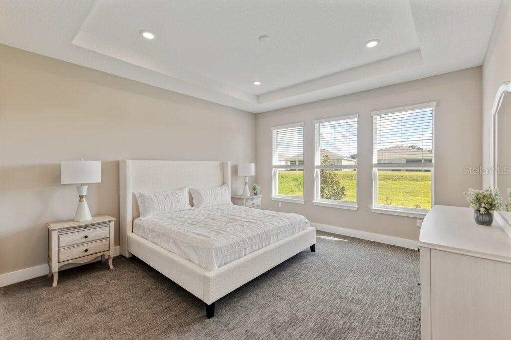 4529 Northwest 53rd Avenue Road Ocala, FL 34482 - Photo 15 of 17 a bedroom with a bed and a large window