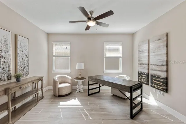 a living room with furniture and a window