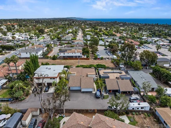 an aerial view of a house with a garden