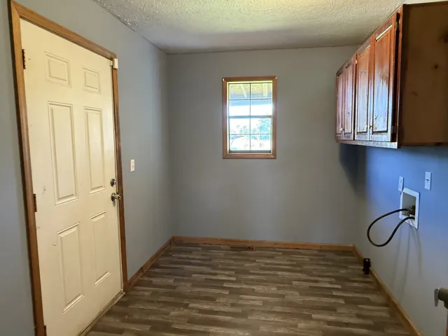 a view of a field with an ocean