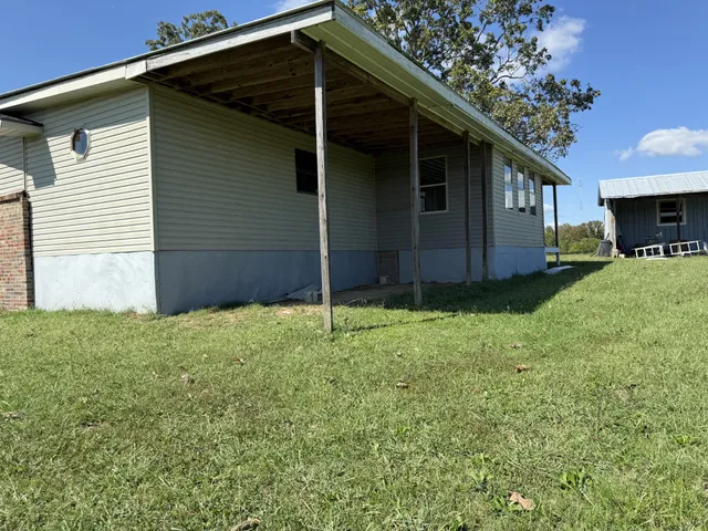 a view of outdoor space with wooden fence