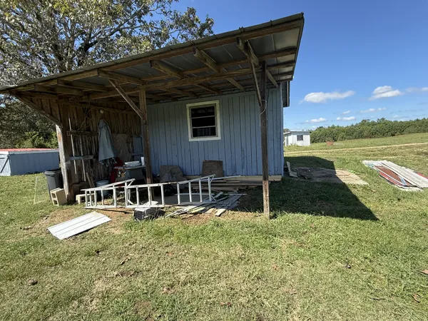 a view of a field with an trees