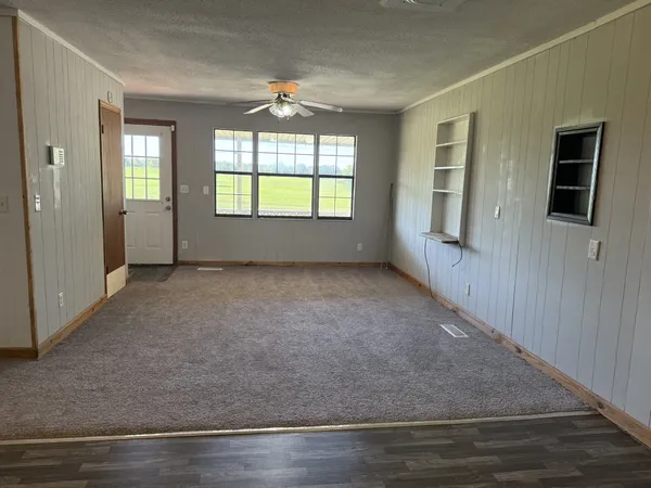 a view of an empty room with a window