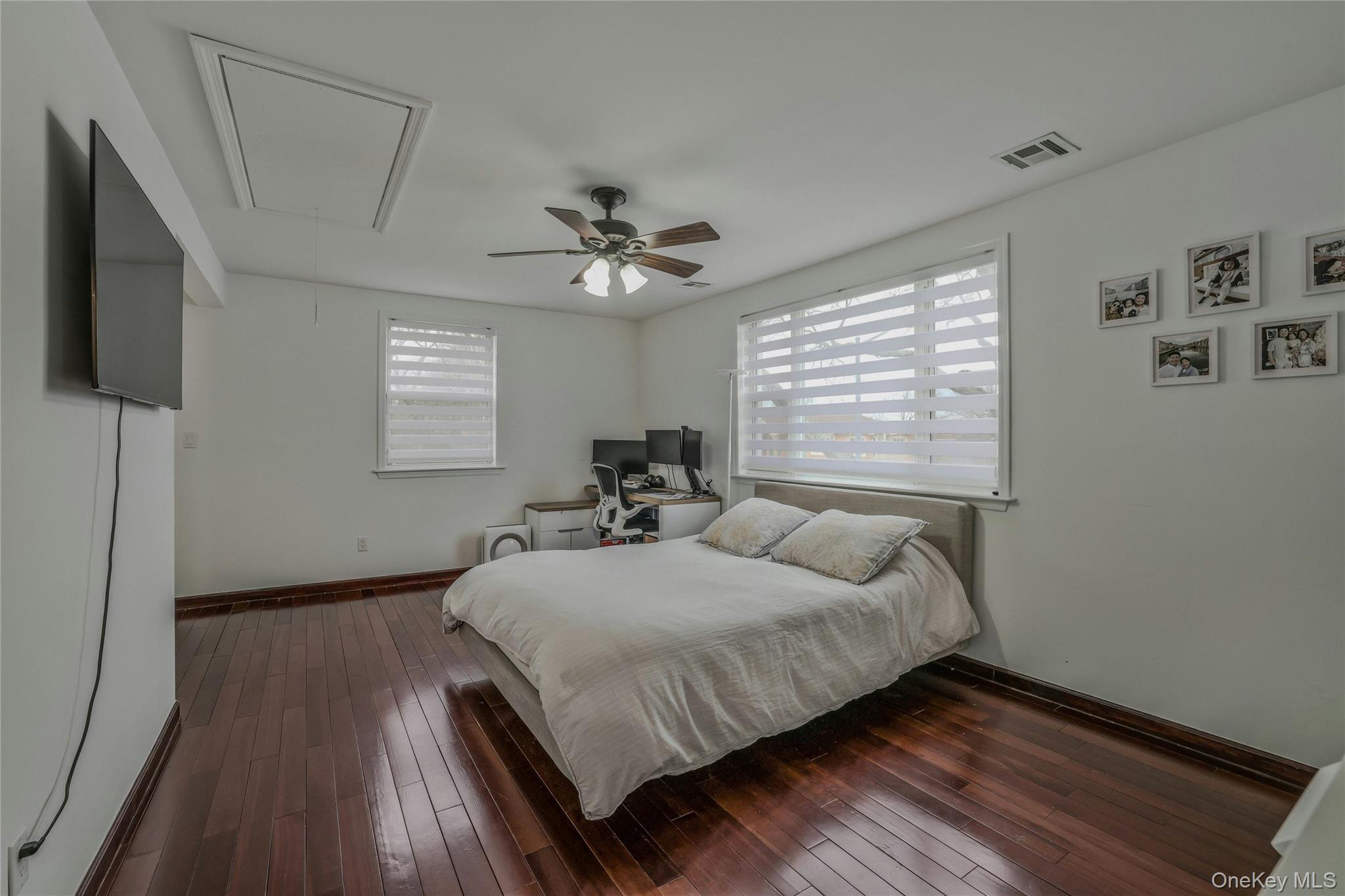 22904 67th Avenue, Unit 38 Queens, NY 11364 - Photo 11 of 17 a bed room with a bed and a window