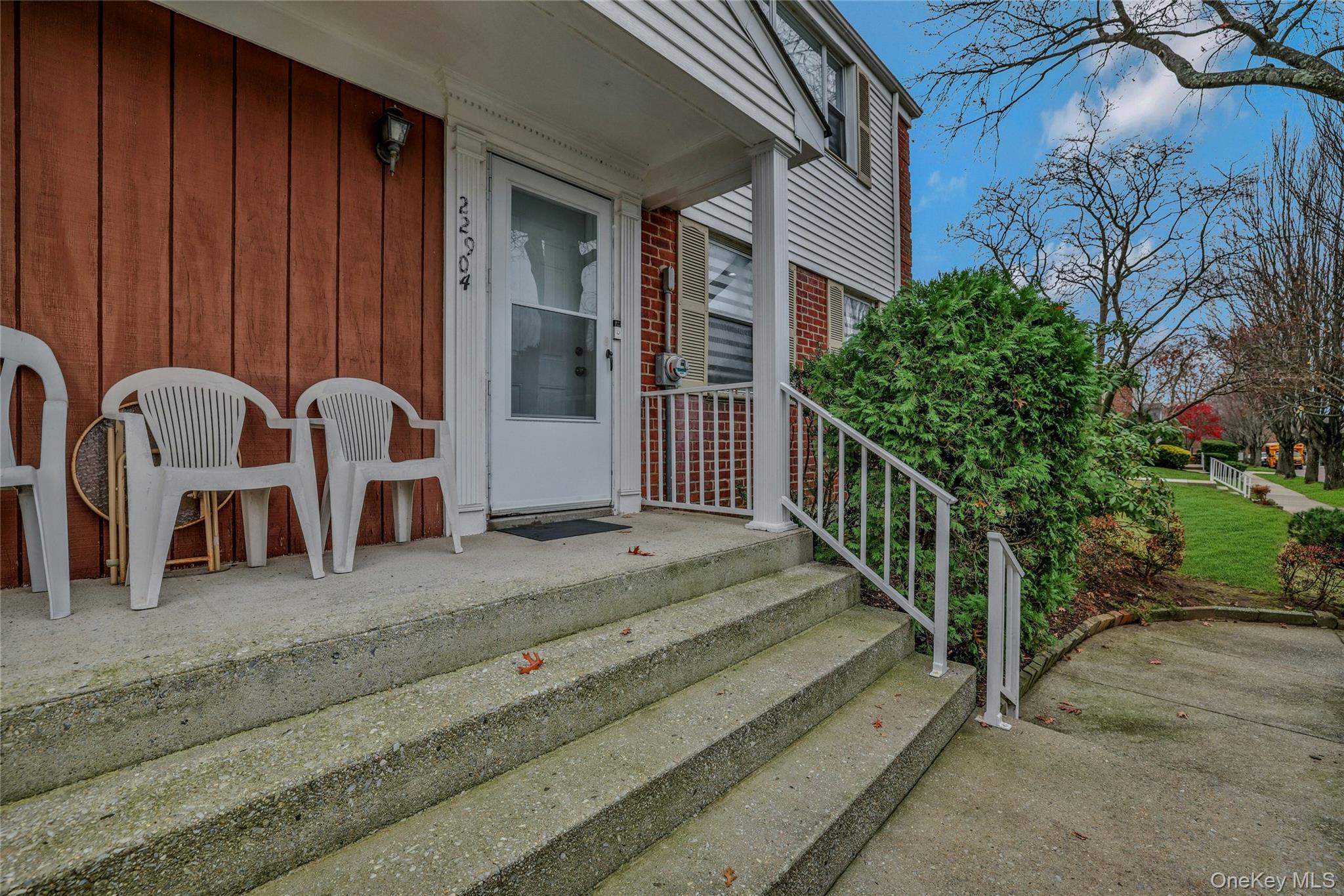 22904 67th Avenue, Unit 38 Queens, NY 11364 - Photo 2 of 17 a view of a house with backyard and porch