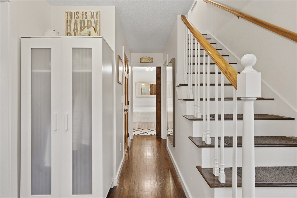 55 Ridgeview Drive Falmouth, MA 02540 - Photo 23 of 32 a view of a hallway with wooden floor and staircase