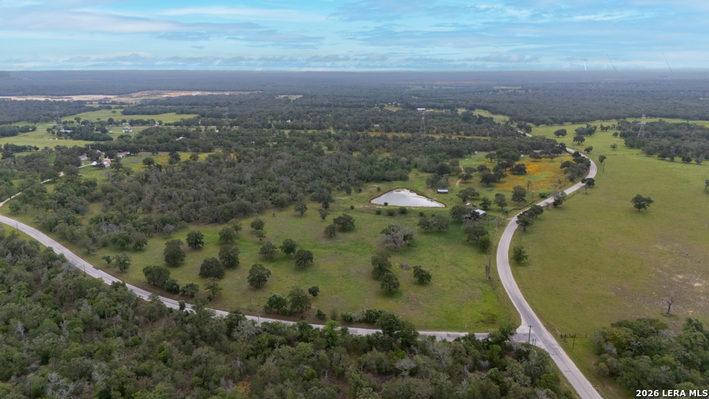 104 Longhorn Road Stockdale, TX 78160 - Photo 37 of 47 an aerial view of a residential houses with outdoor space and trees