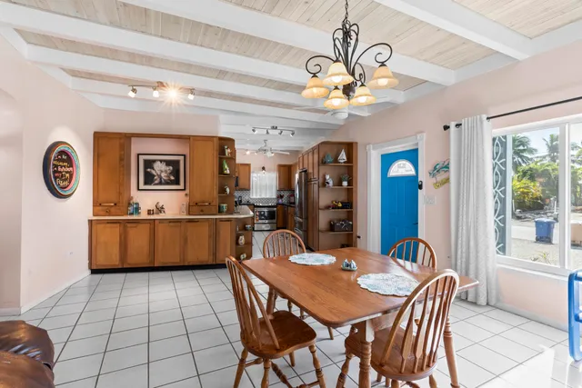 a view of a dining room with furniture and a chandelier