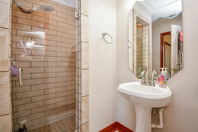 a bathroom with a sink and a mirror