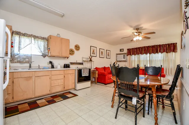 a view of kitchen with cabinets and wooden floor