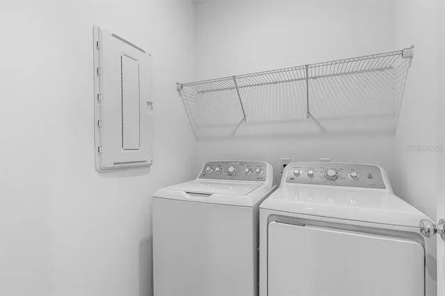 a utility room with dryer and washer