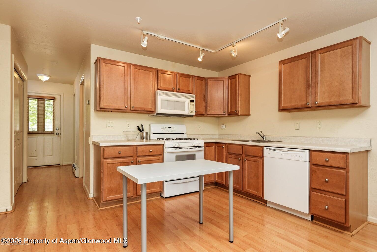 604 Lakeside Drive Basalt, CO 81621 - Photo 14 of 28 a kitchen with stainless steel appliances granite countertop a stove a sink dishwasher and a refrigerator with wooden floor