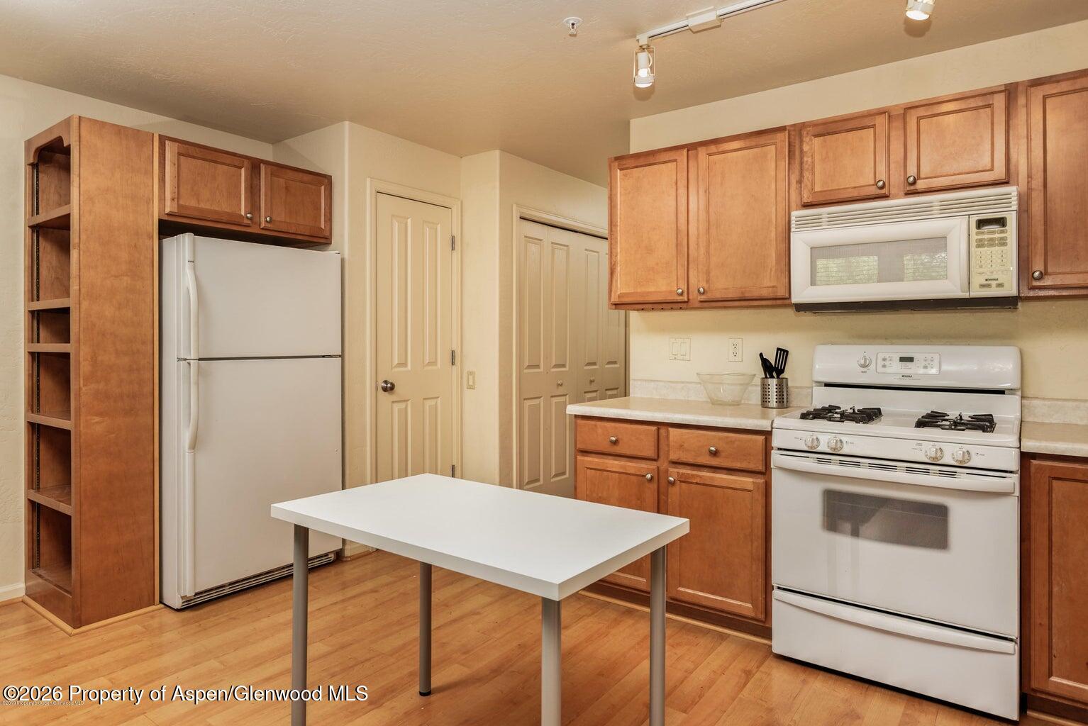 604 Lakeside Drive Basalt, CO 81621 - Photo 17 of 28 a kitchen with stainless steel appliances a stove a refrigerator and cabinets